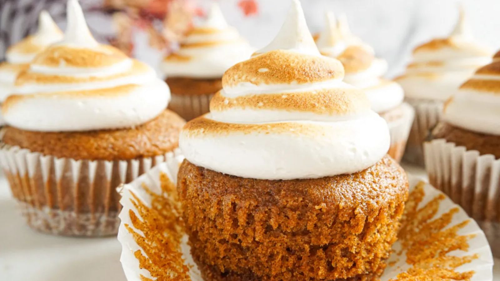 Pumpkin cupcakes with marshmallow frosting.