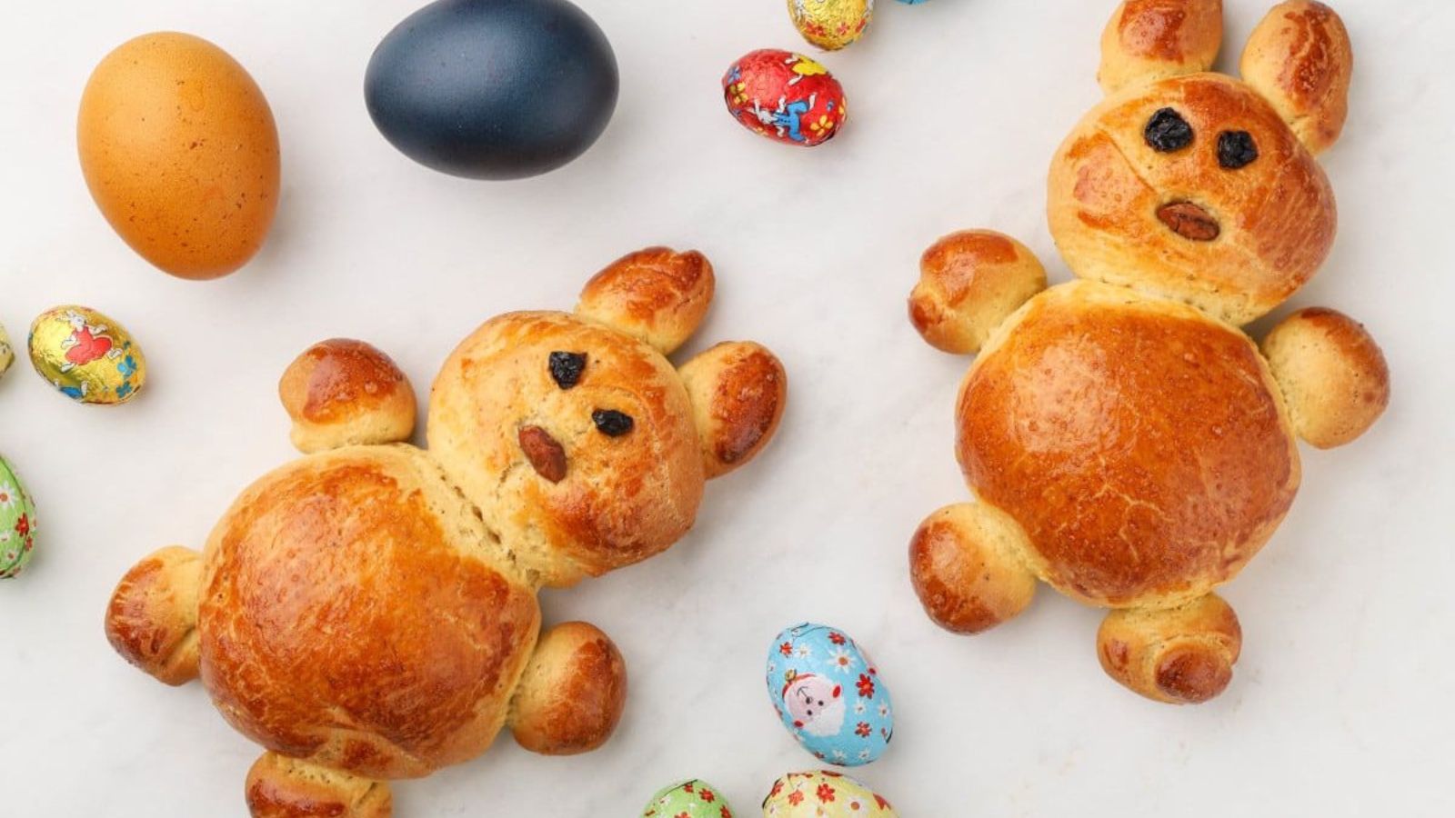 Greek Easter bunny bread with eggs on the side.