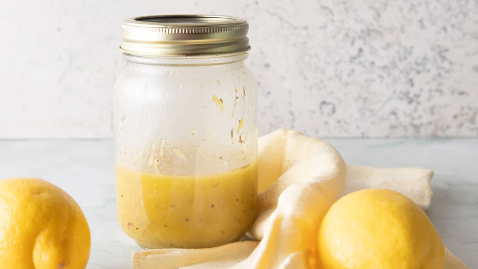 Lemon dressing in a jar.
