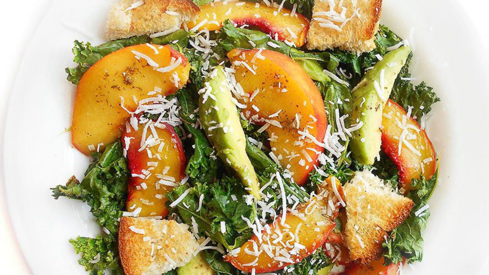 Kale salad on a white plate.