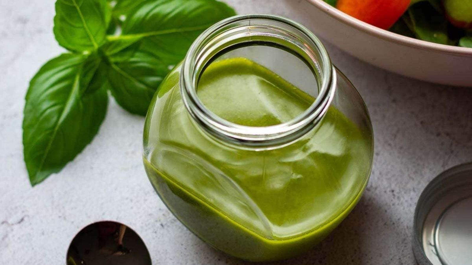 Lemon basil vinaigrette in a jar.