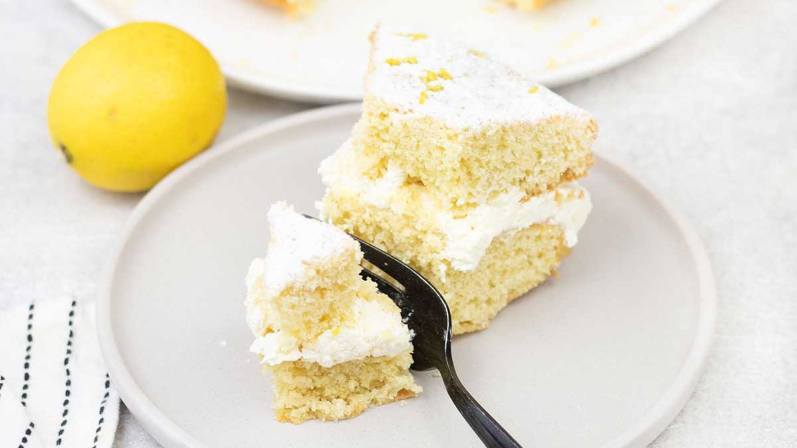 A slice of lemon cake on a plate.