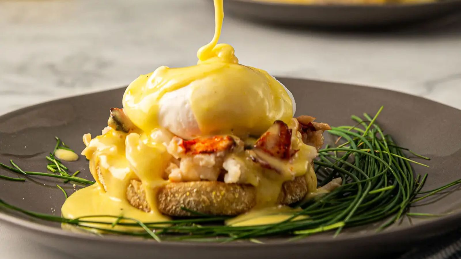 Lobster benedict on a plate.