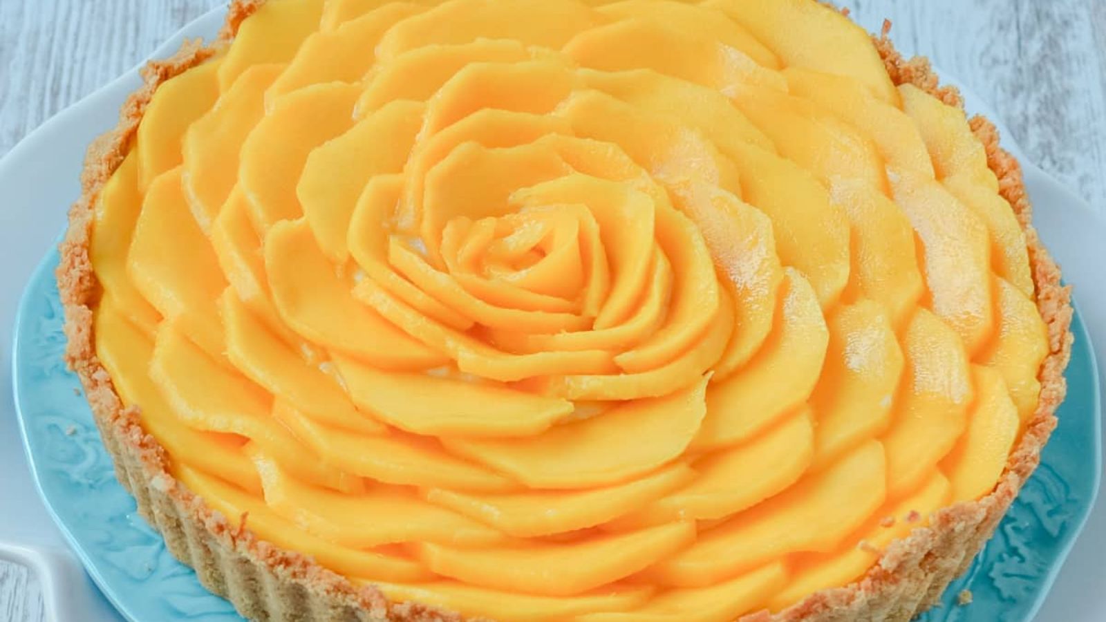 A close up shot of mango tart.