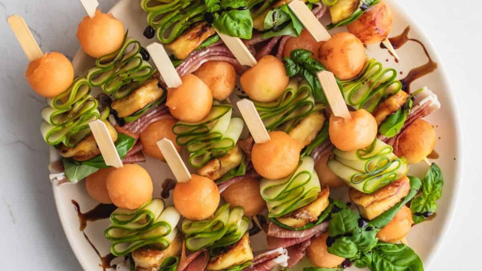 Melon and prosciutto skewers.