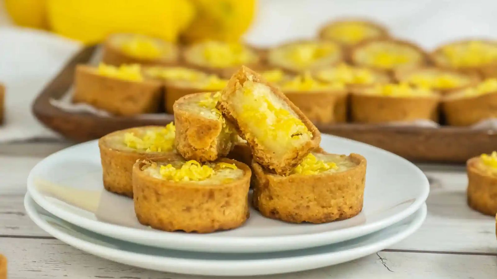 Lemon tarts on a plate.