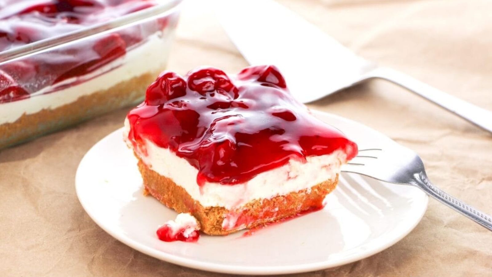 A slice of cherry cheesecake.