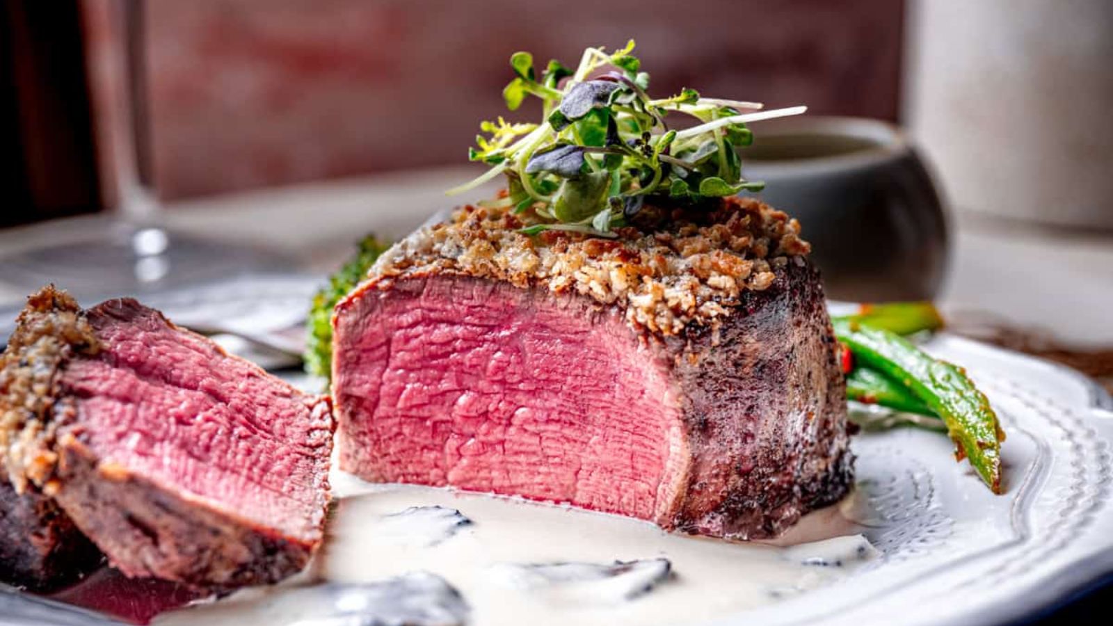 Slcied filet mignon on a plate.