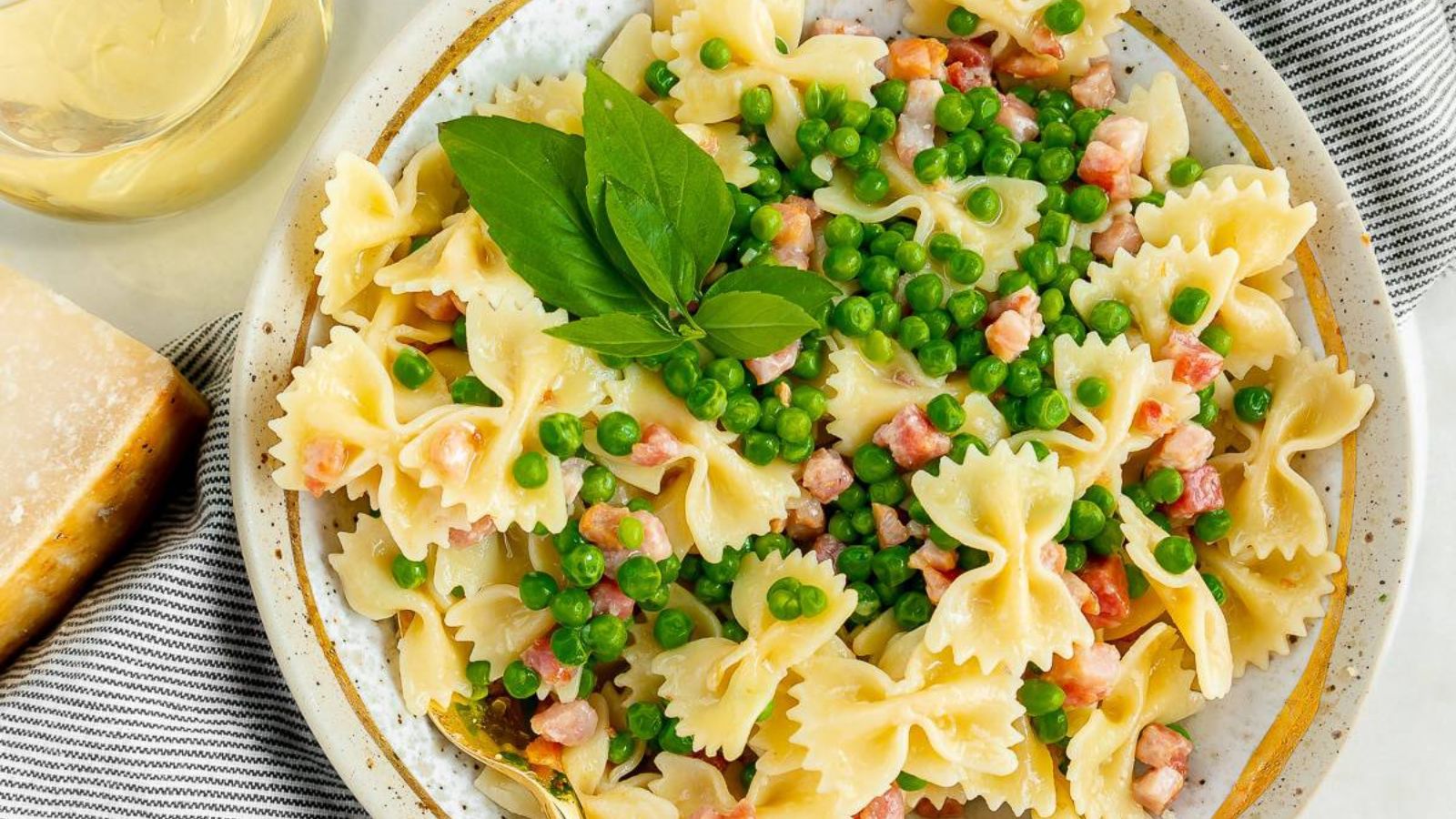 Pasta with peas on a plate.