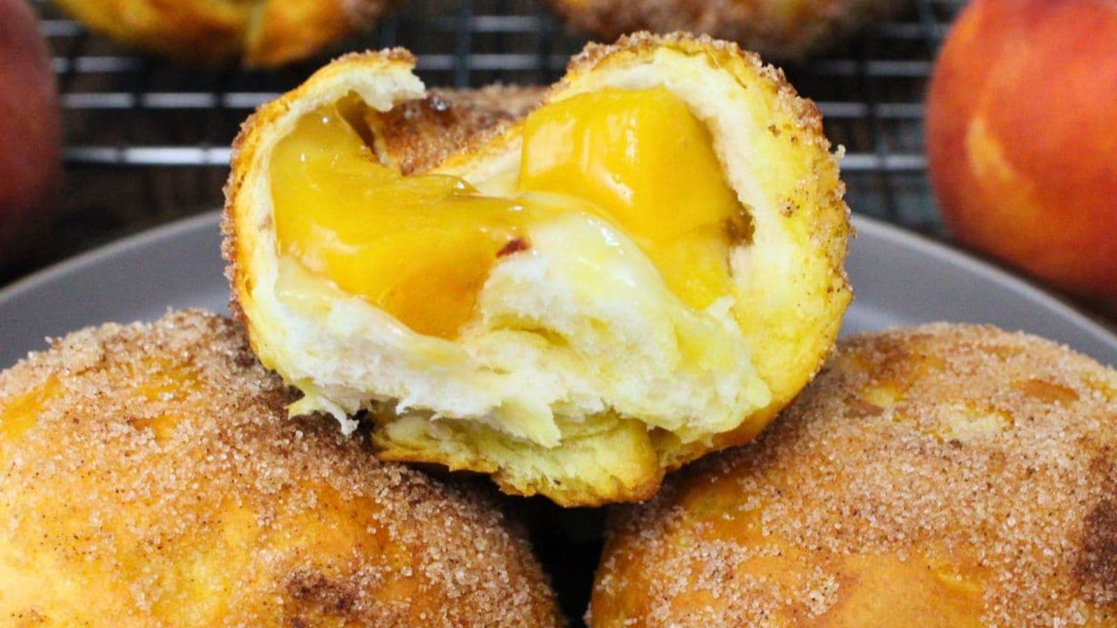 Peach pie biscuit bombs on a plate.