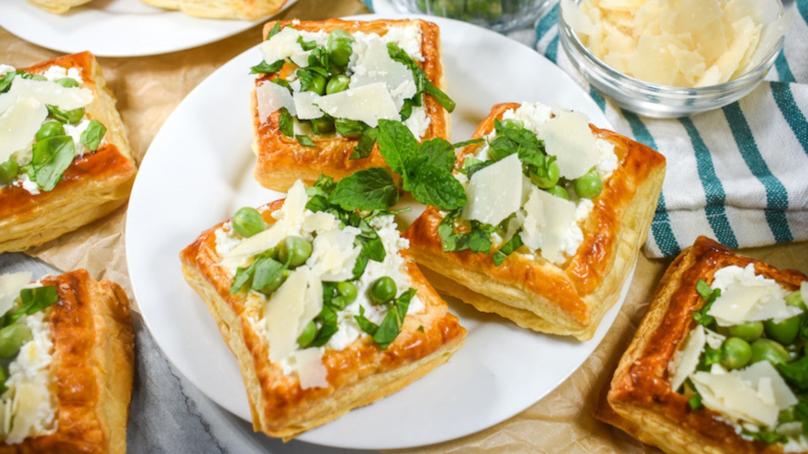 Puff pastry tartlets on a plate.