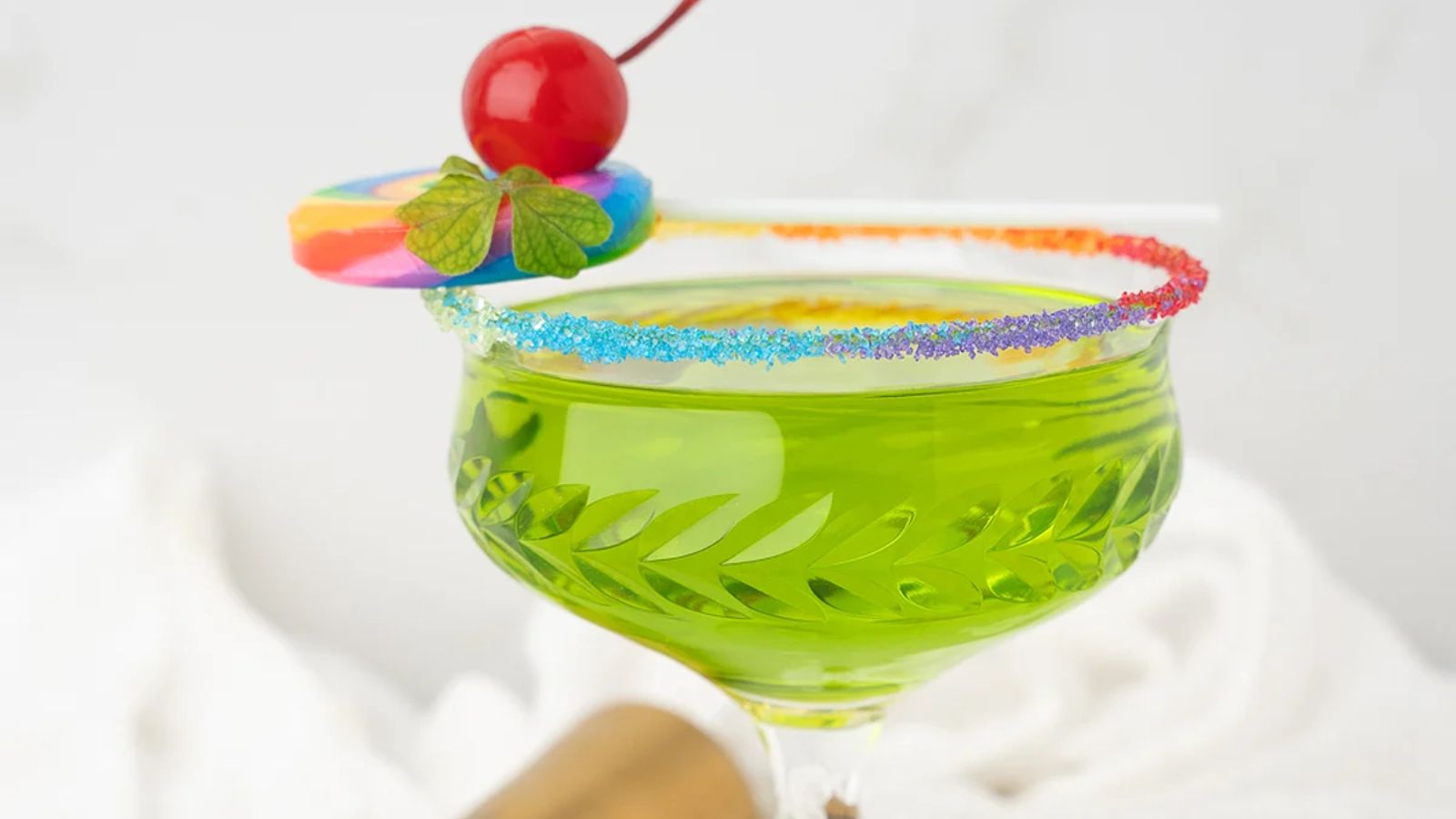 Irish whiskey cocktail with rainbow rim.