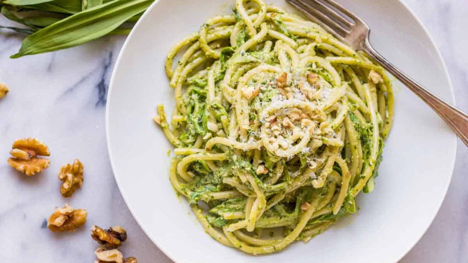 Pesto pasta on a plate.
