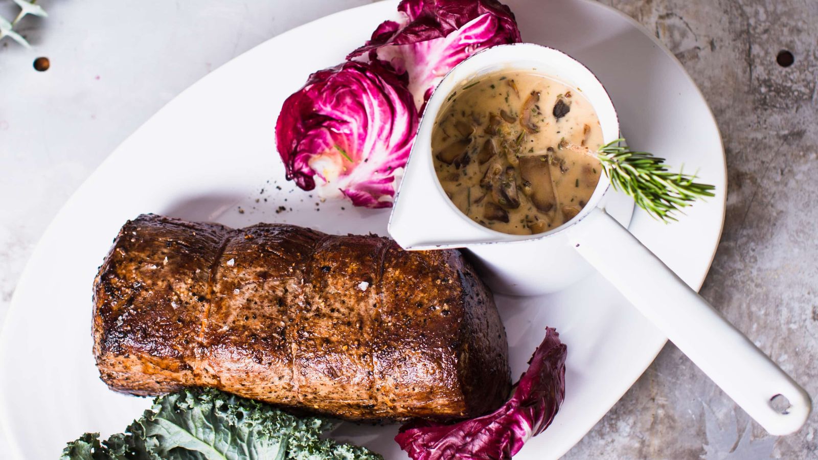 Roast bef tenderloin on a plate.