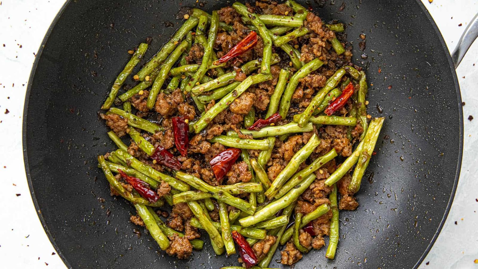 Fried green beans in a pan.