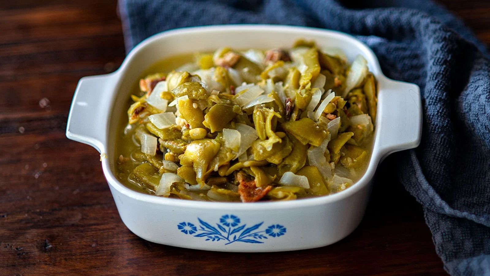 Green beans in a white casserole dish.