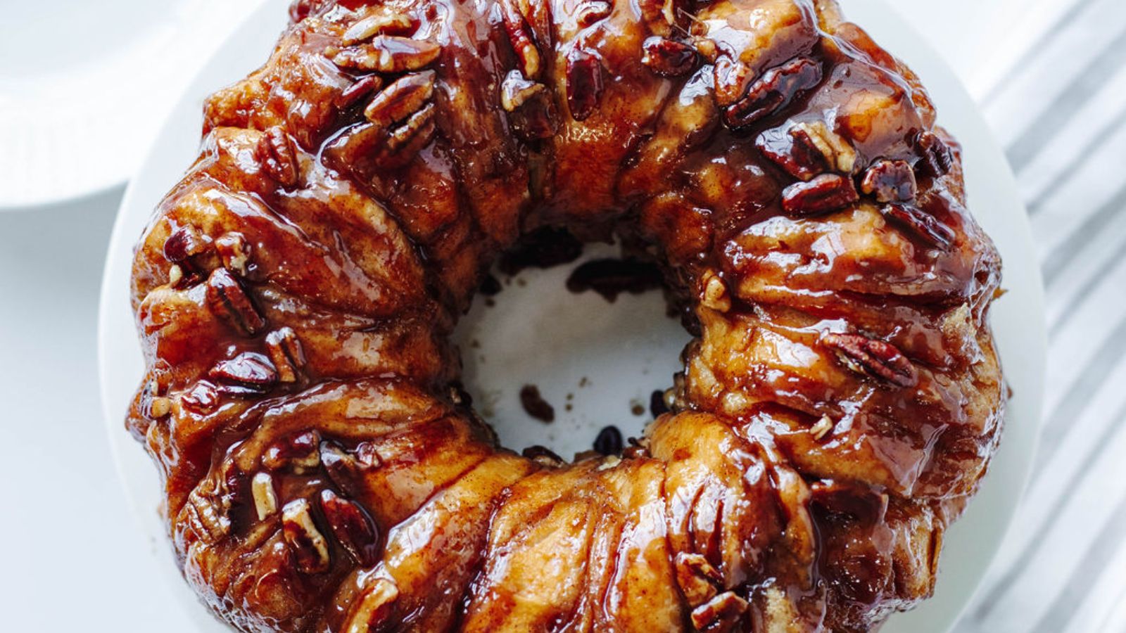 Sticky bun on a marble surface.