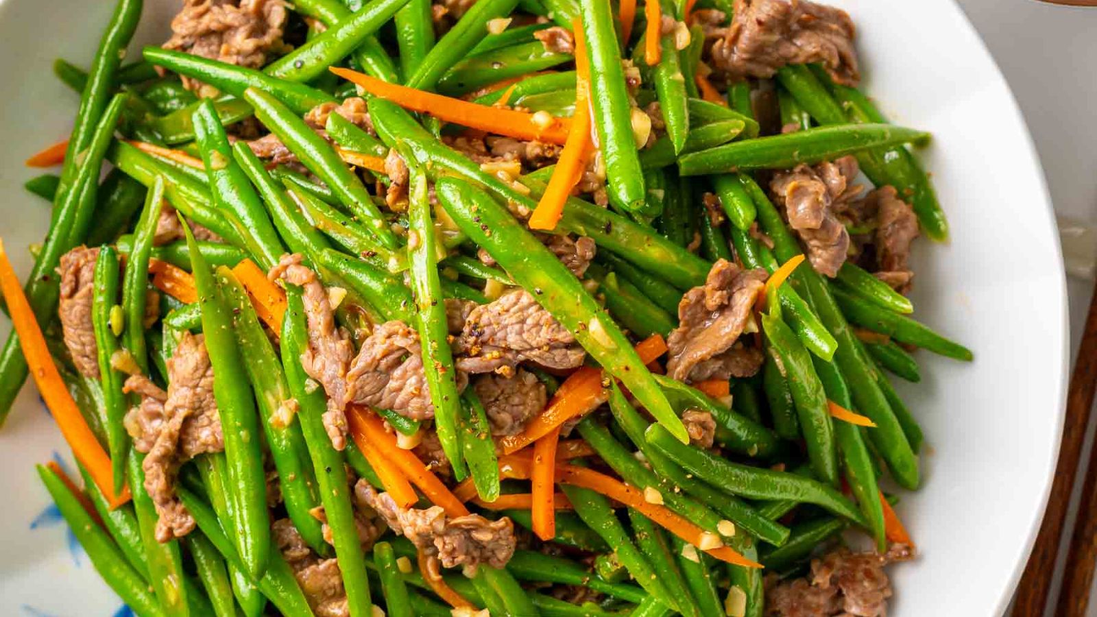 Green beans with beef on a plate.