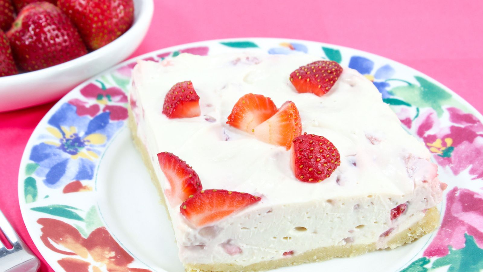A slice of strawberry cheesecake.