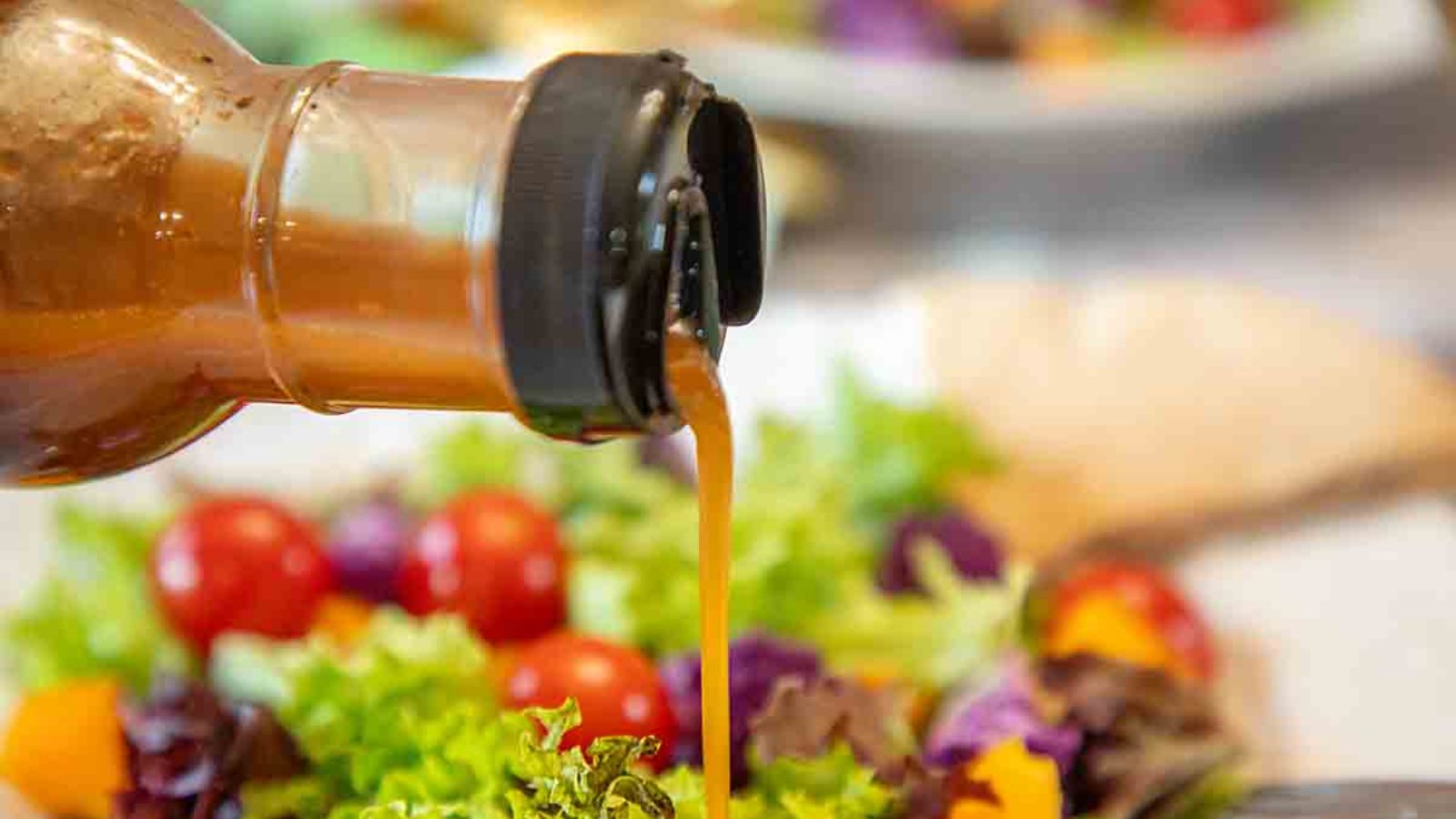Pouring tomato vinaigrette.