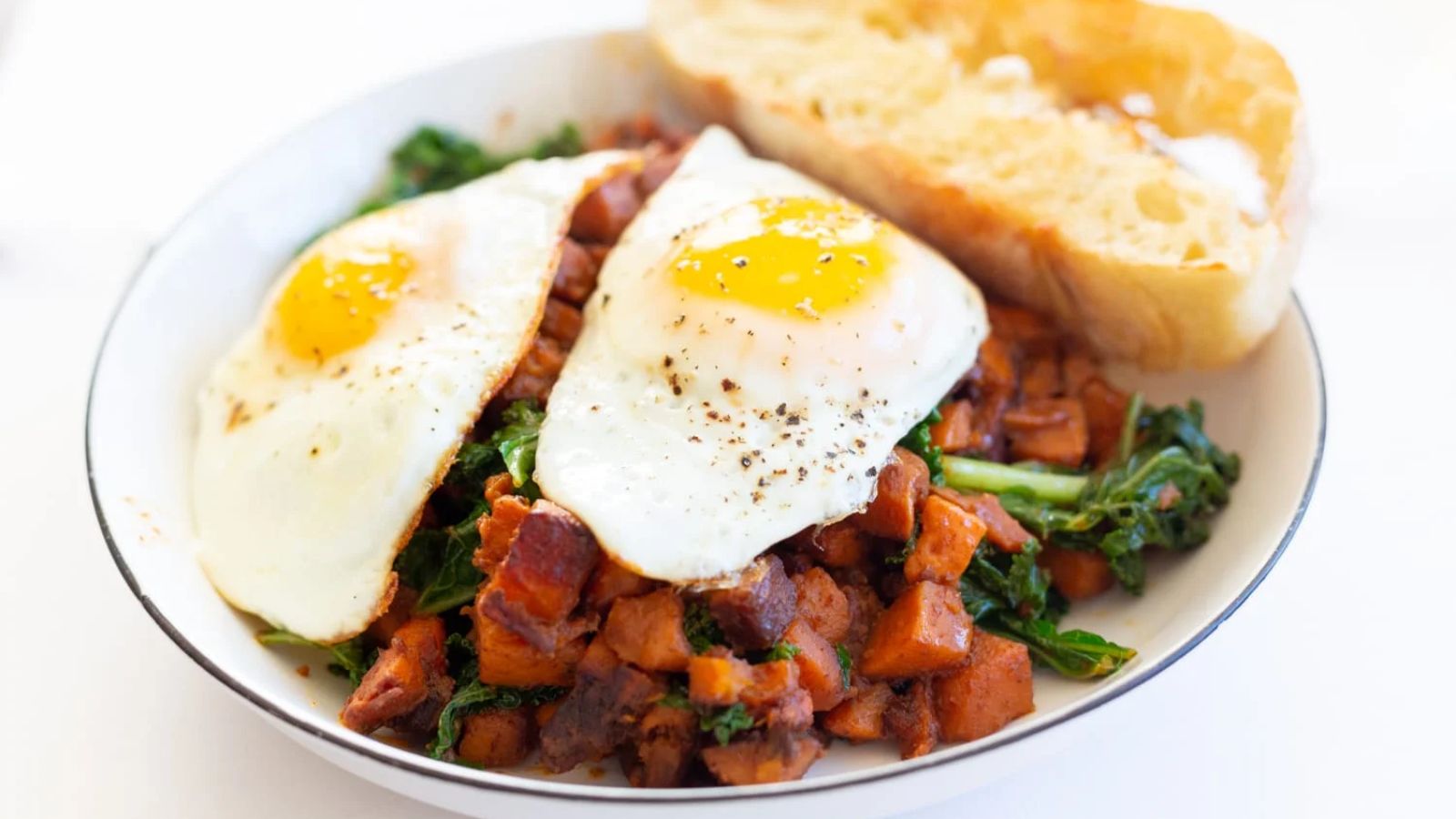 Sweet potato kale hash with sunny side up eggs.