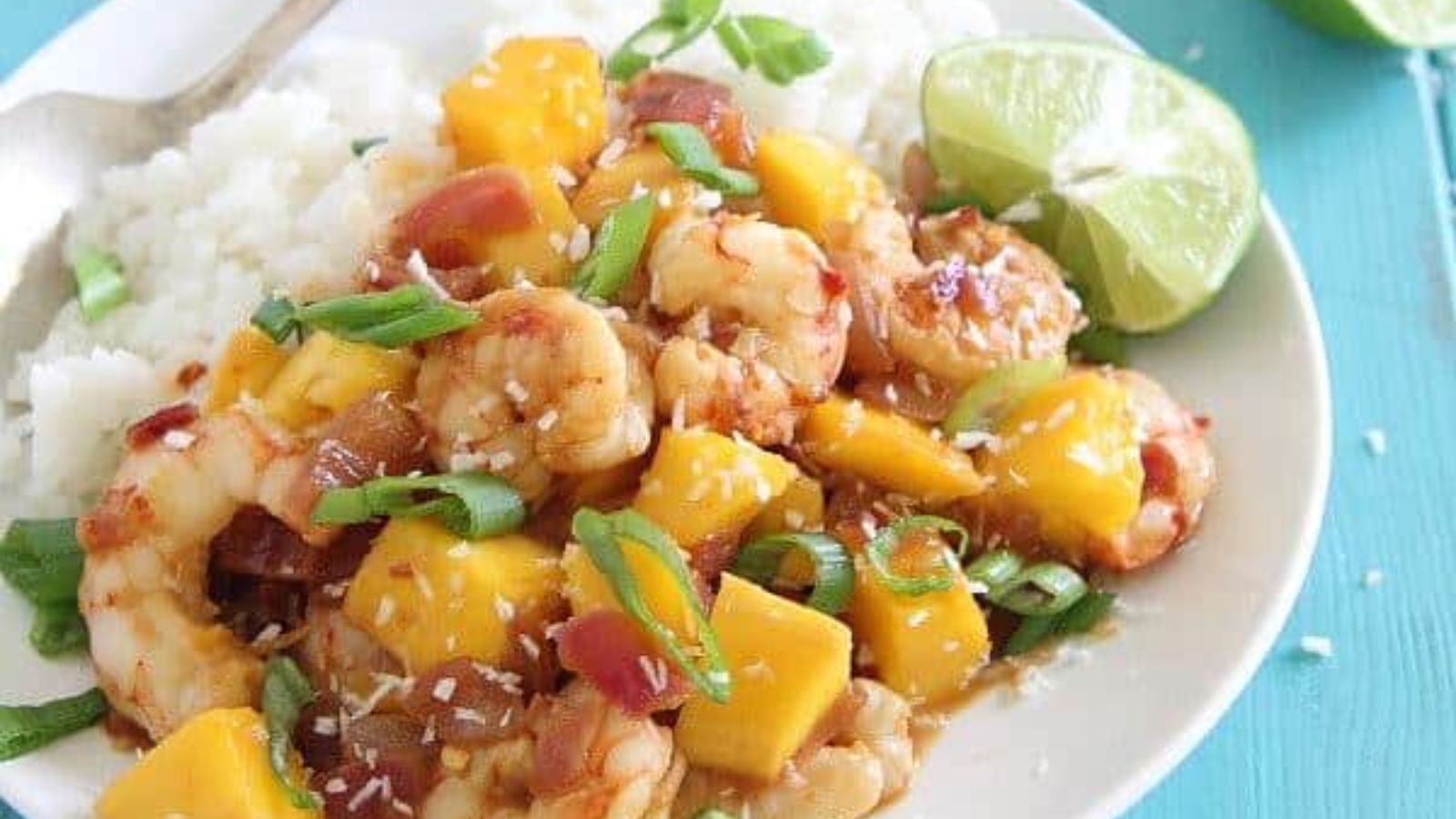 Shrimp with mango on a plate.