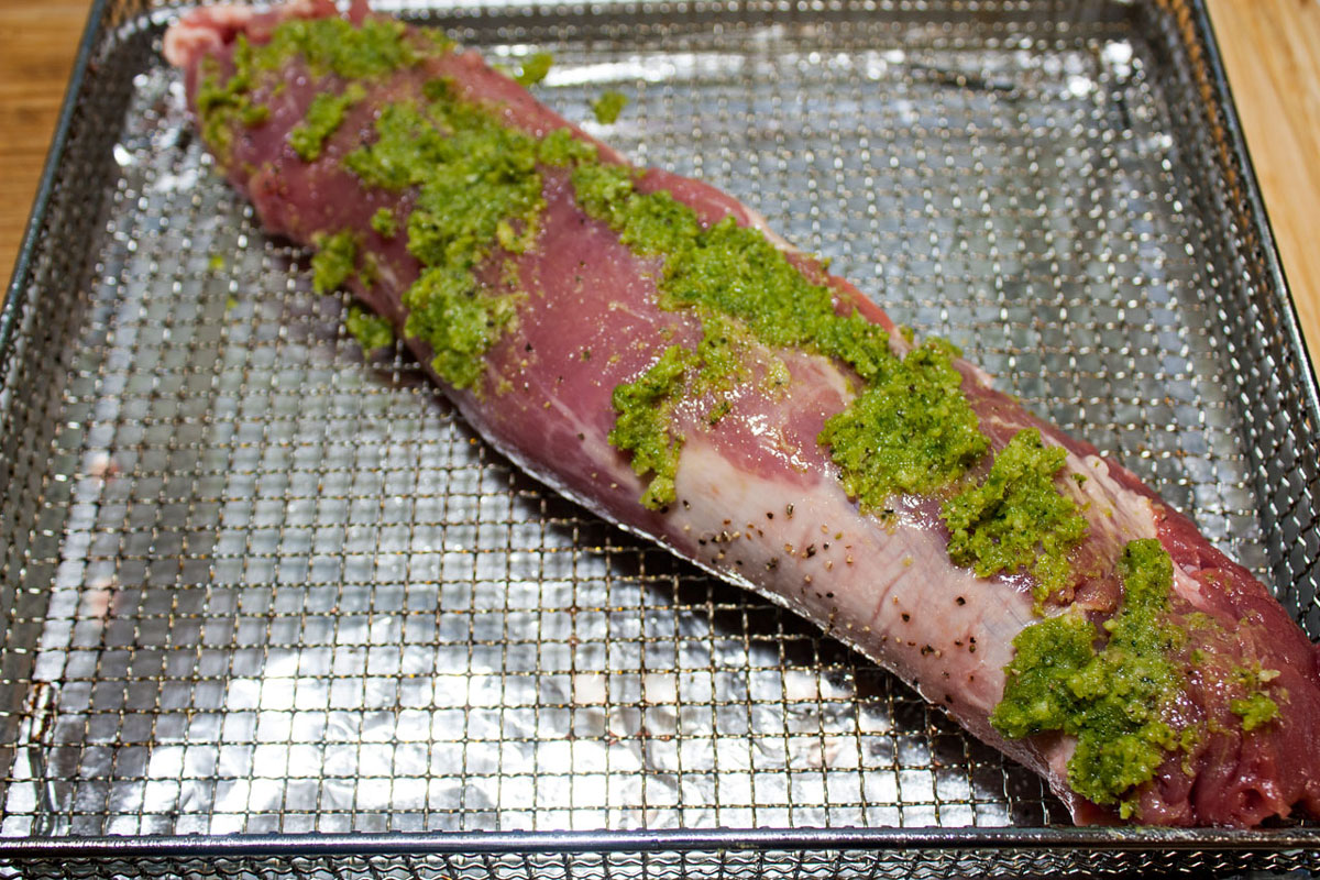 Tenderloin spread with pesto on top.