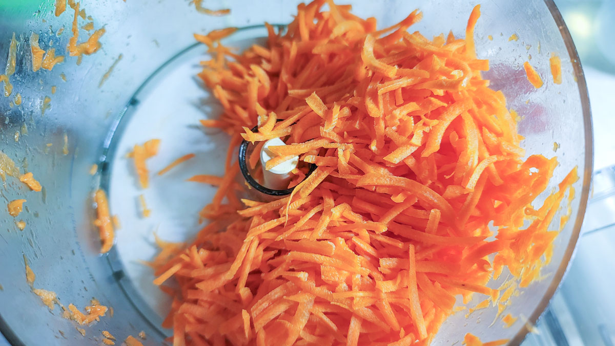Food processor bowl with grated carrots/