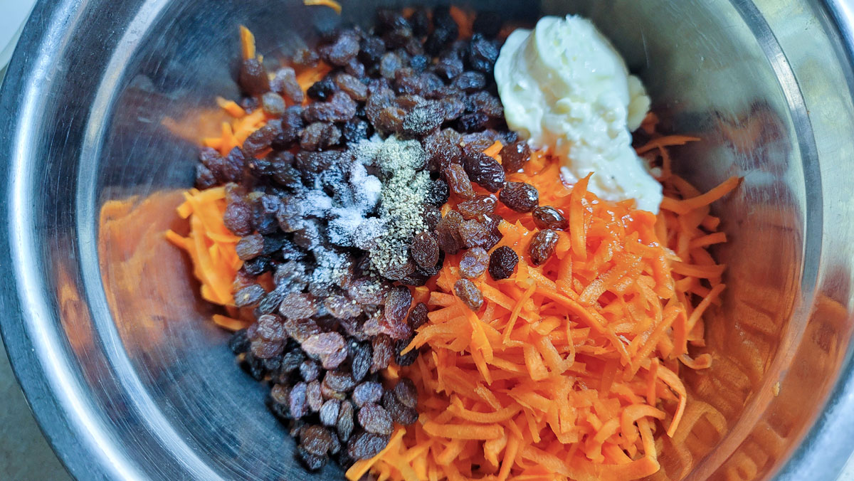 Remaining ingredients added to a bowl with the carrots.