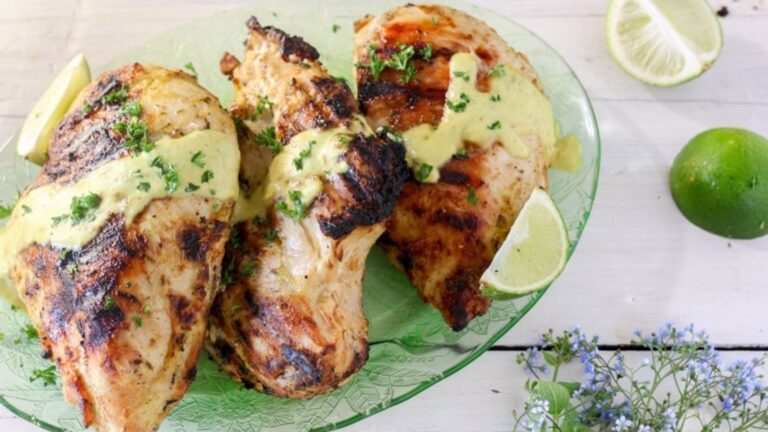 Chicken with coconut curry on a plate.