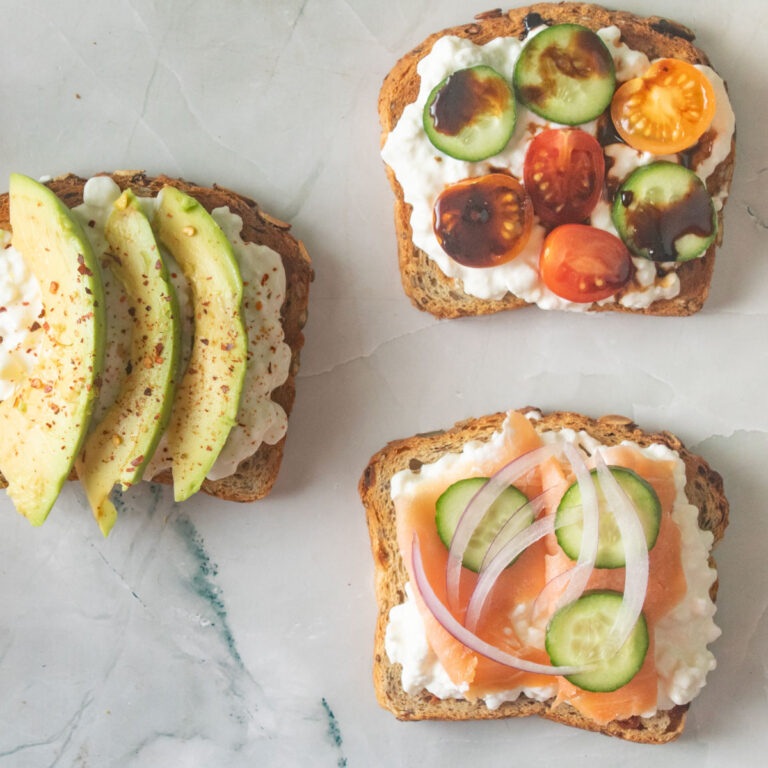 Cottage cheese topped toast with various toppings.