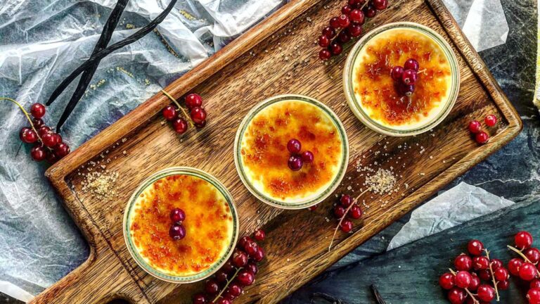 Three ramekins with creme brulee.