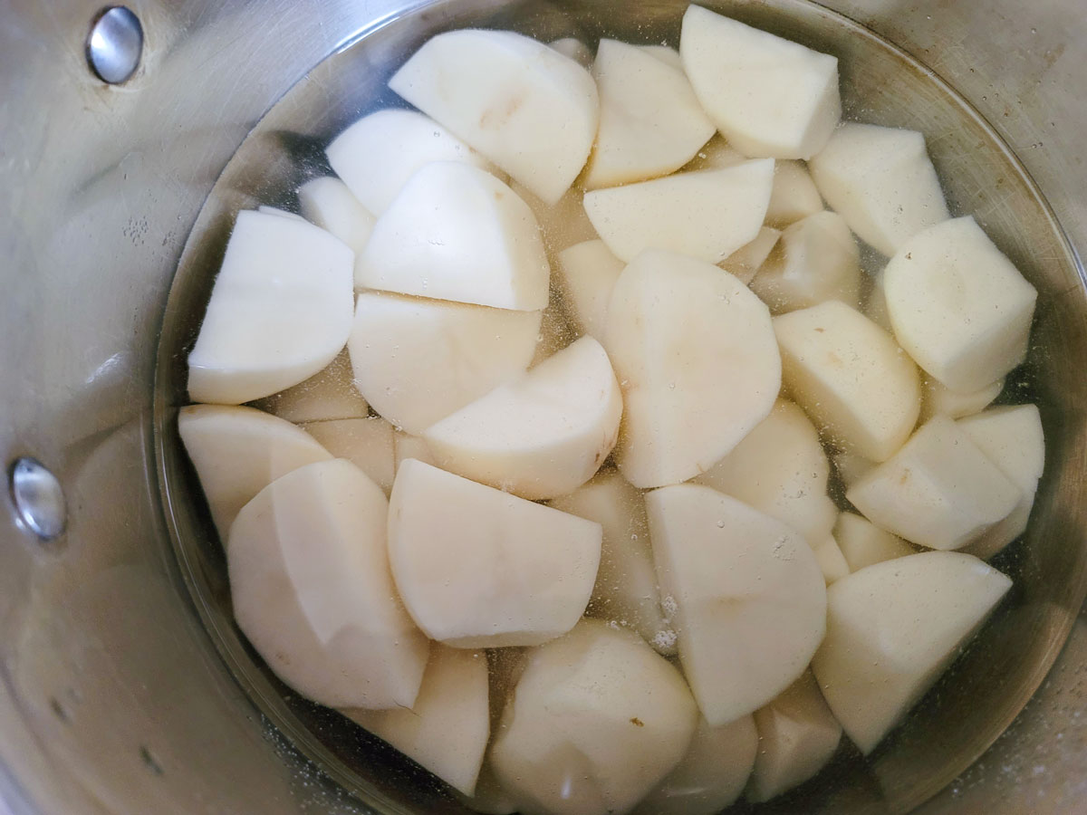 Potatoes in a large pot covered with water.