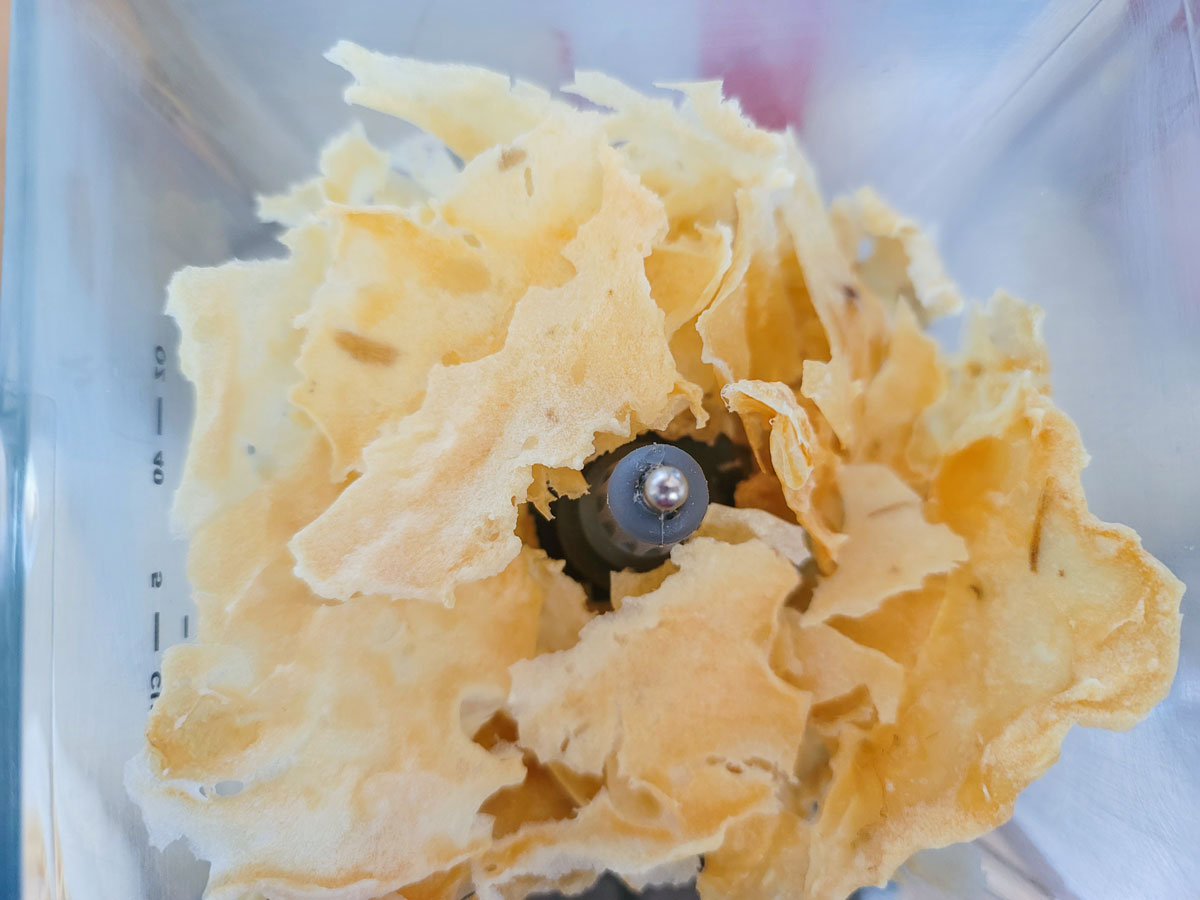 Broken pieces of the mashed in a blender container.
