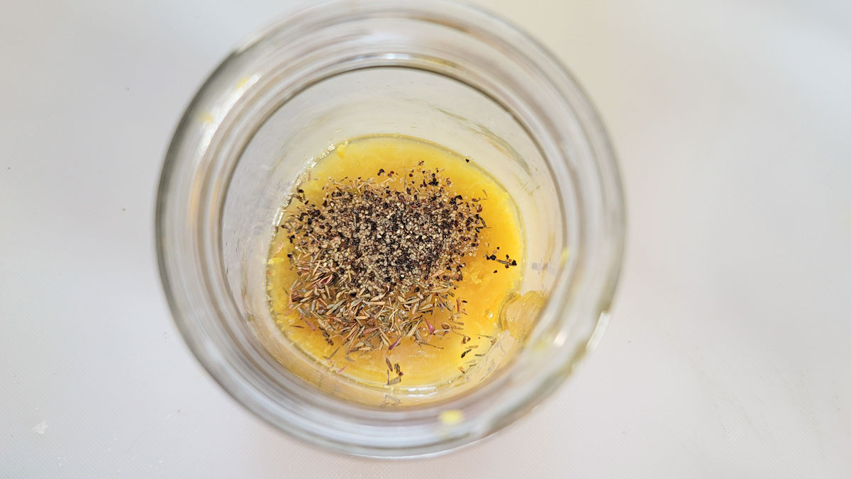 Ingredients added to a mason jar.