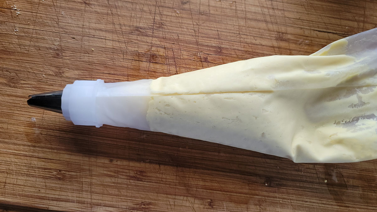Yolk mixture in a piping bag.