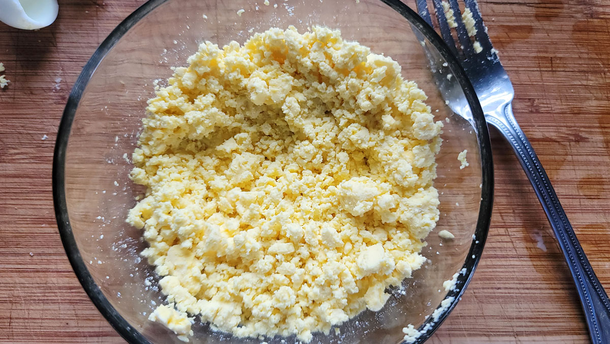 Mash the eggs with a large tined fork.