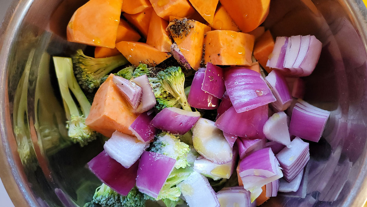 Vegetables drizzled with olive oil and tossed with salt and pepper.