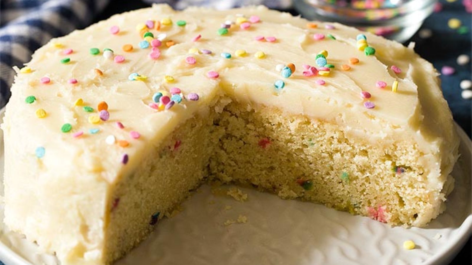 Birthday cake with slice.