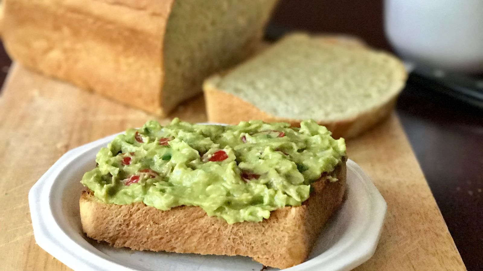 Load bread with avocado filling.