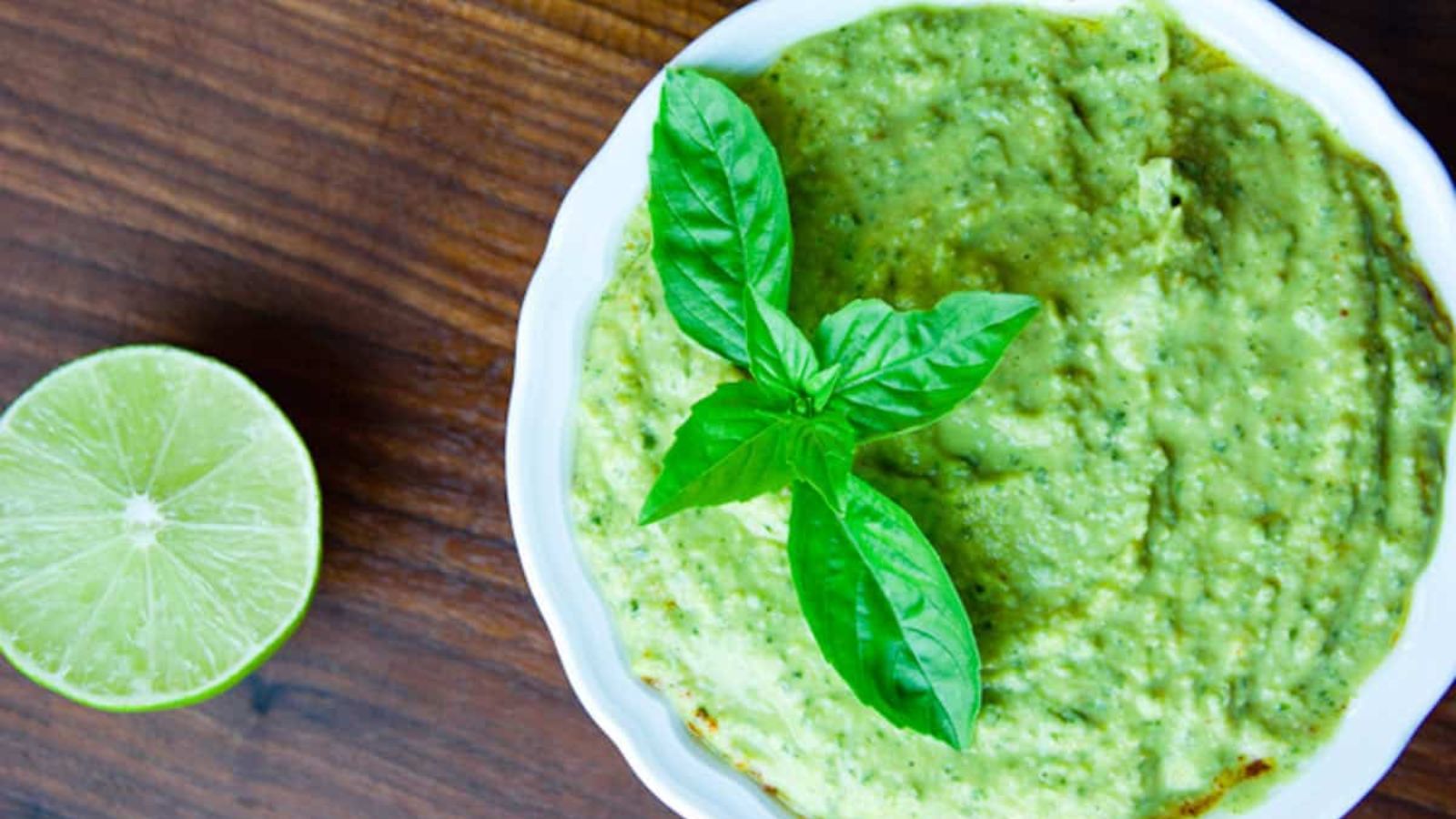 Lime hummus in a bowl.