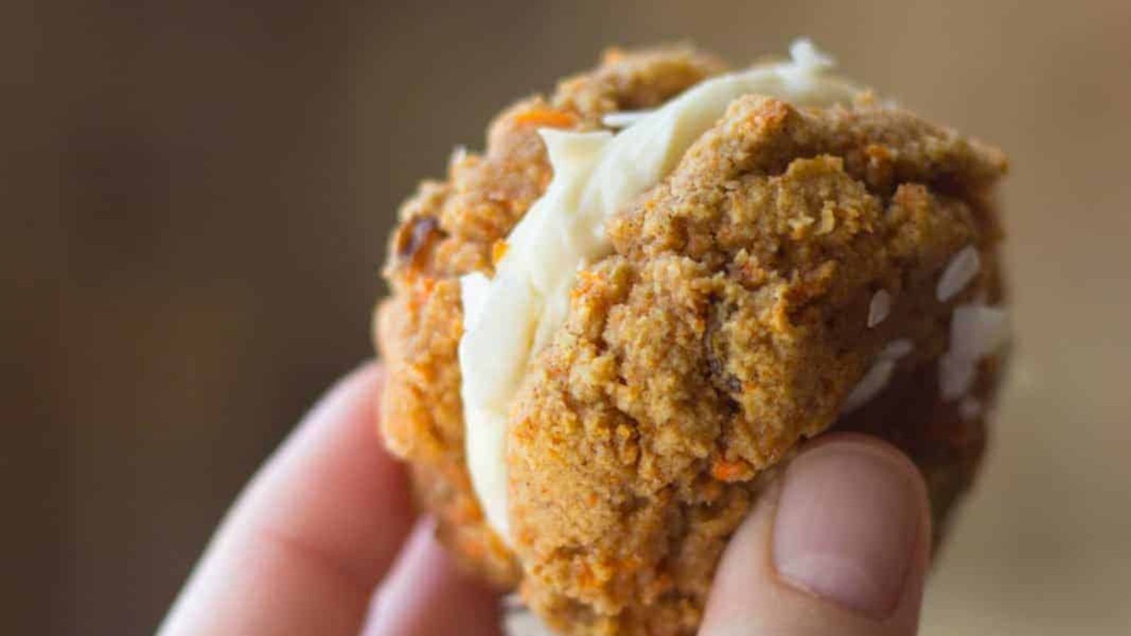 A close up shot of carrot cake cookie sandwich.