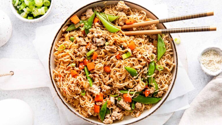 Chicken stir fry noodles with chopsticks.
