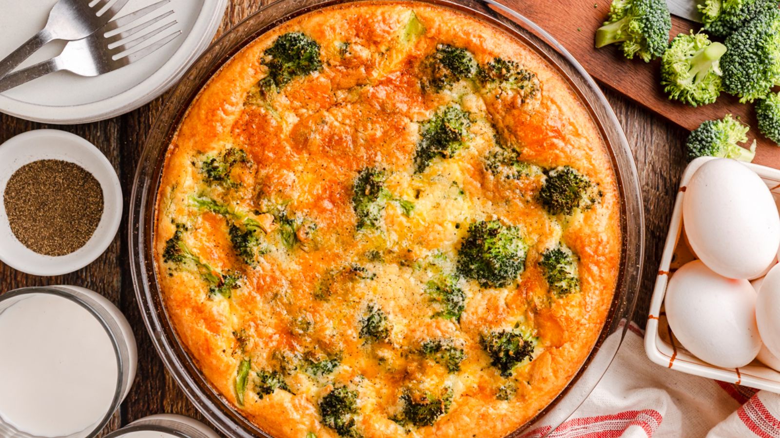 Ham and cheese quiche on a plate.
