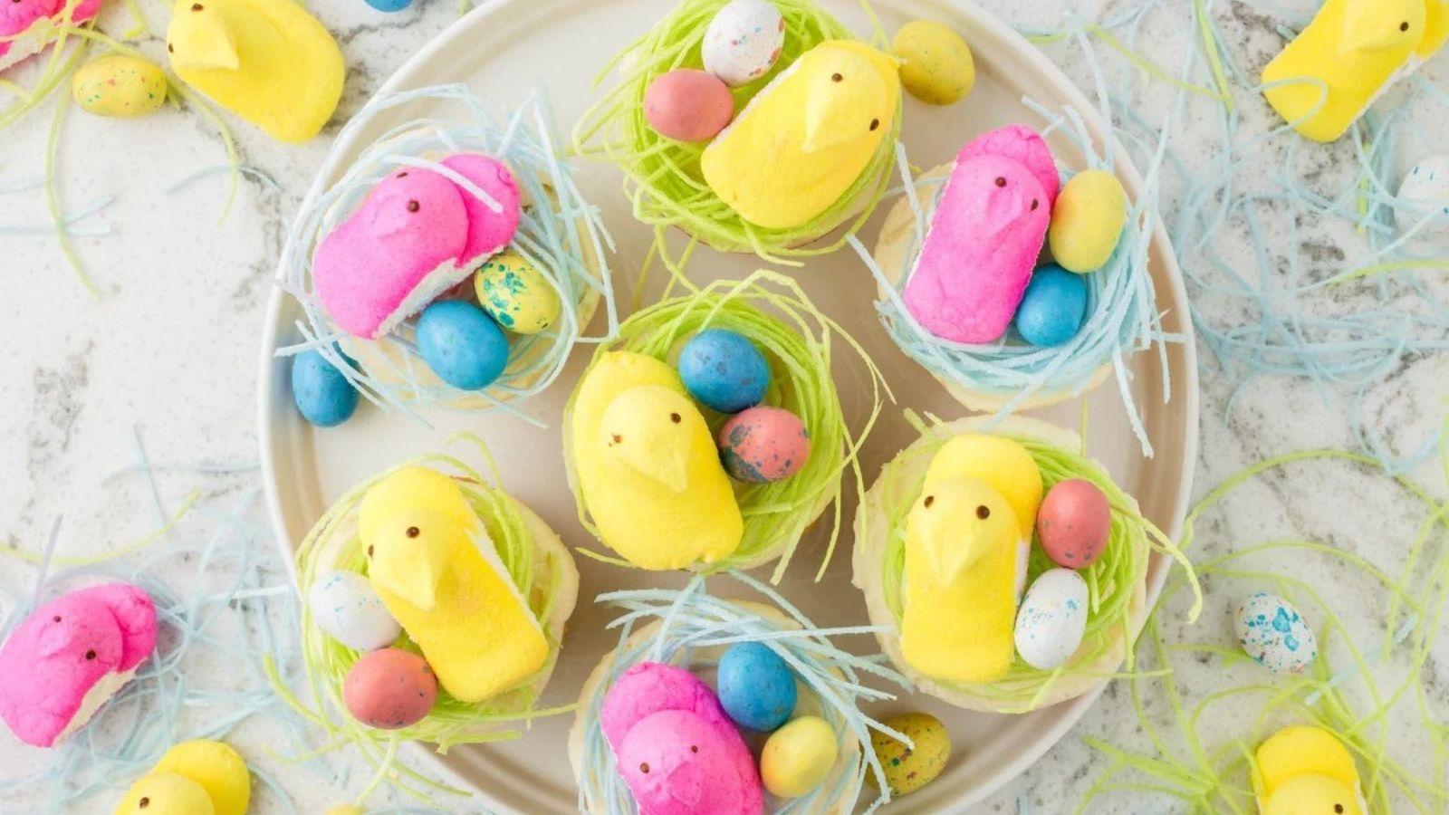 Peep cupcakes on a plate.