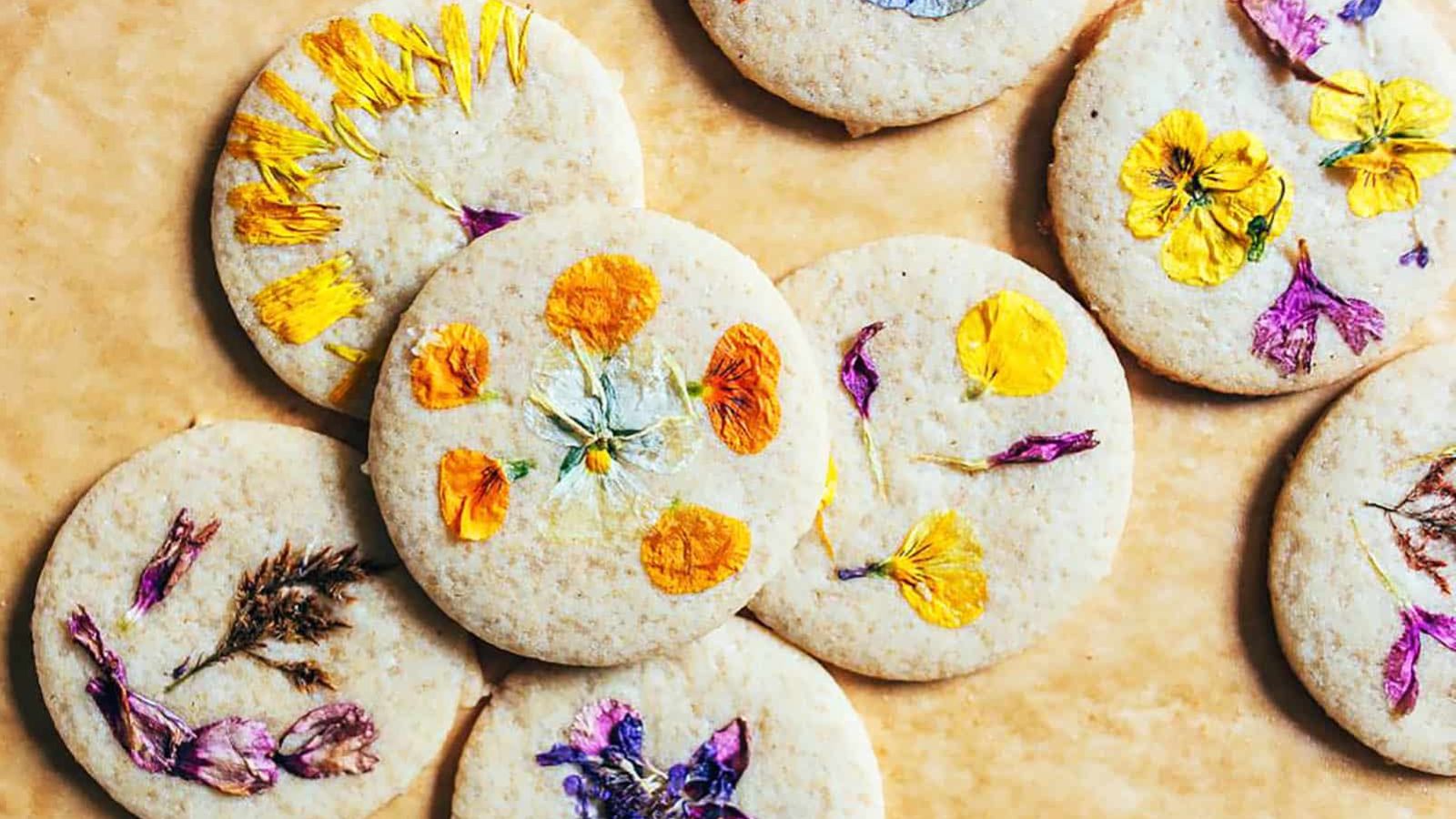 Cookies with edible flower on top.