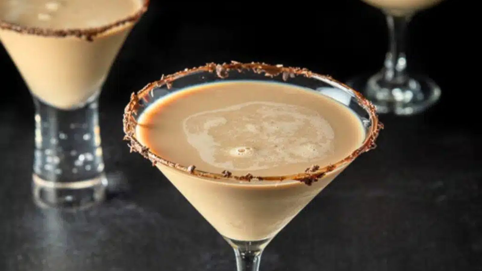 Godiva chocolate in martini glass with chocolate around it.