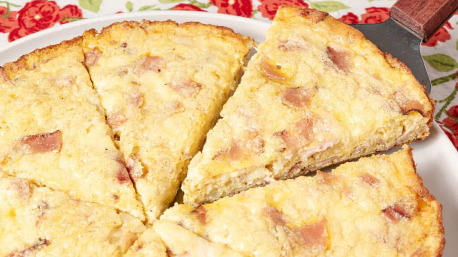 Sliced ham and cheese frittata.