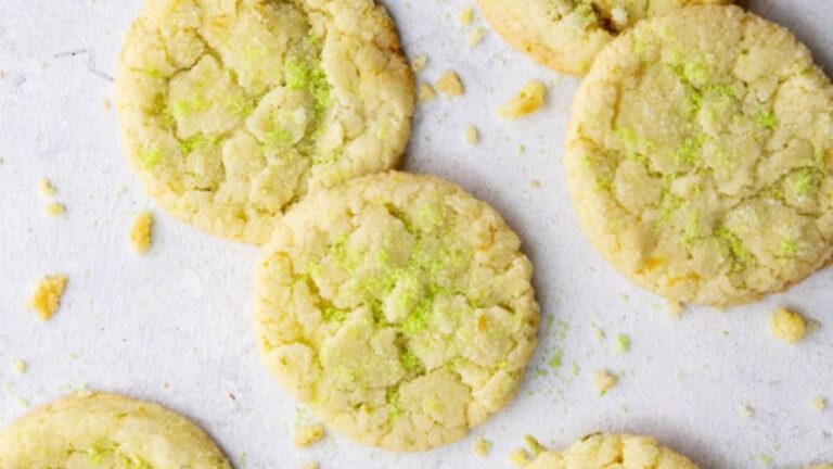 Lime cookies on a white surface.