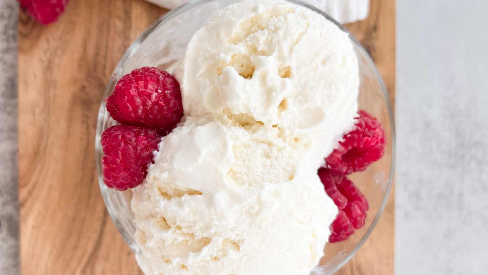 Vanilla ice cream with raspberry toppings.